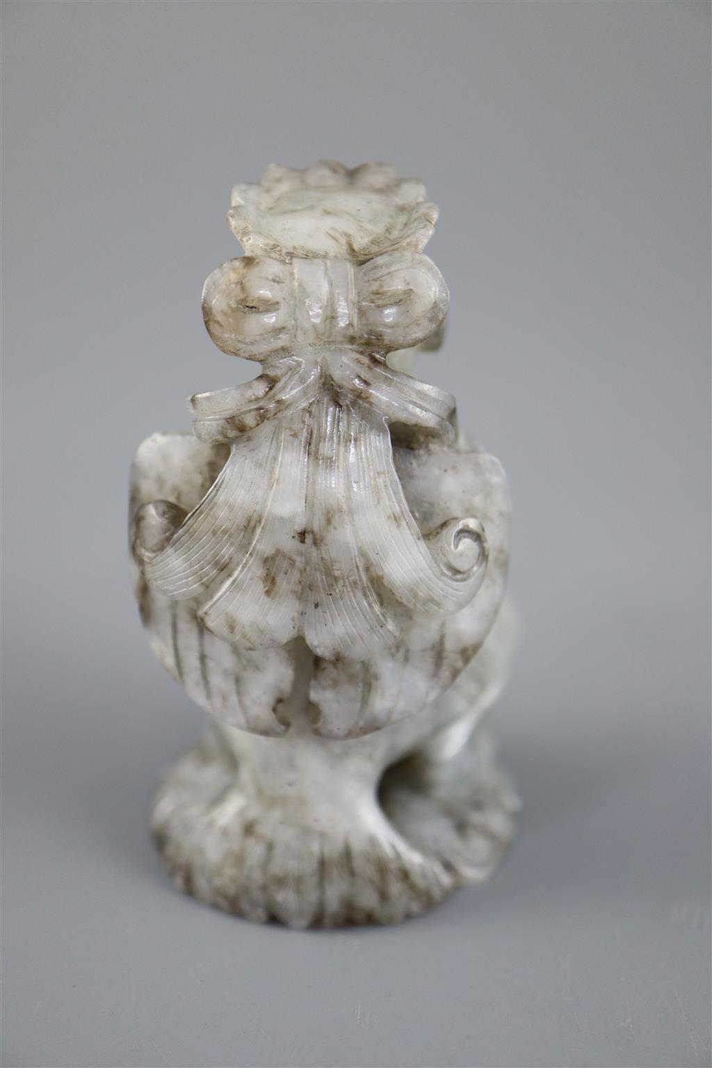 A Chinese grey jade figure, 6.4cm high